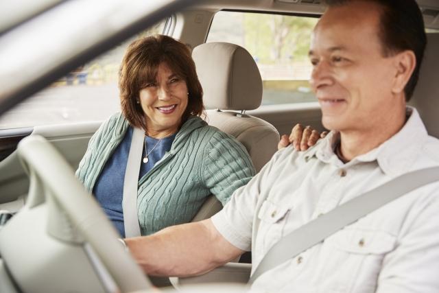 Two people driving in a car