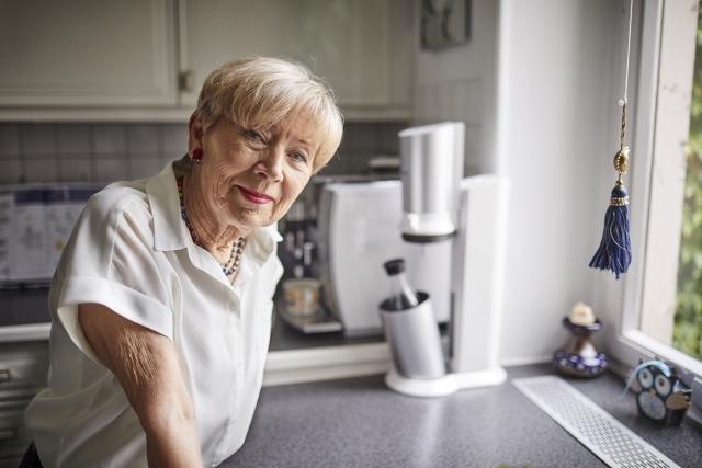 Woman standing in her kitchen