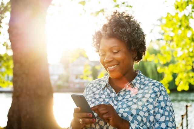 Smiling woman with a cell phone